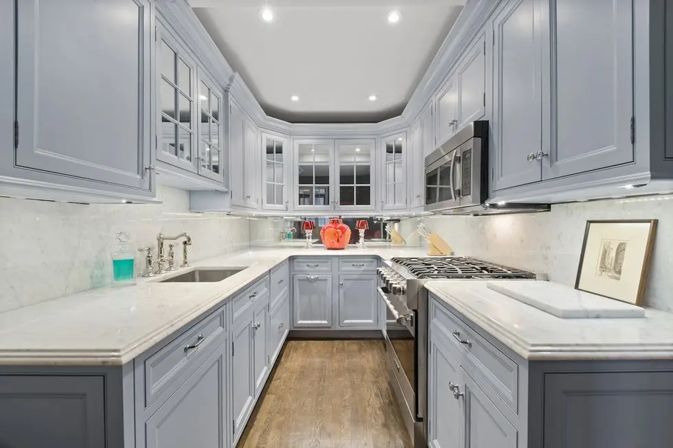 Refinished kitchen cabinets with a modern painted look