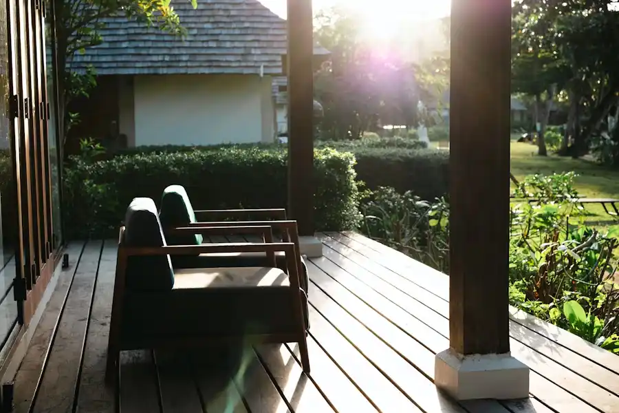 Freshly stained outdoor wooden deck with patio furniture