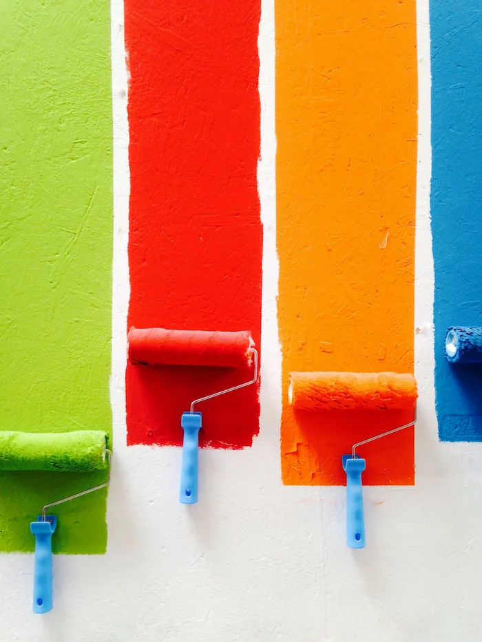 Different colored paint samples on a wall